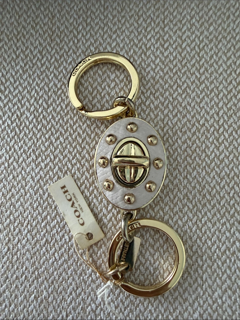 Coach Gold and White Turnlock Oval Valet Key
